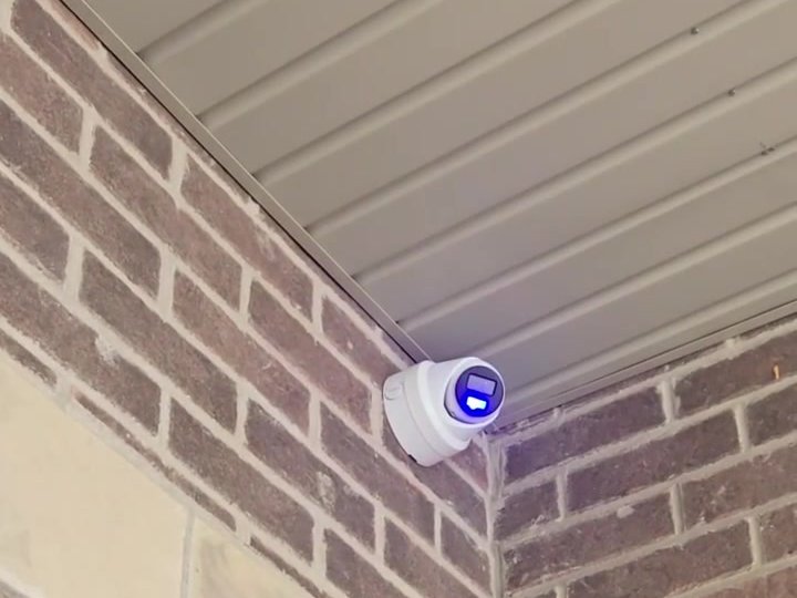 Corner-mounted security camera on a Markham home after installation