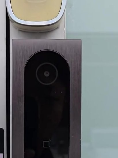 Door access reader with built-in camera at an office entrance