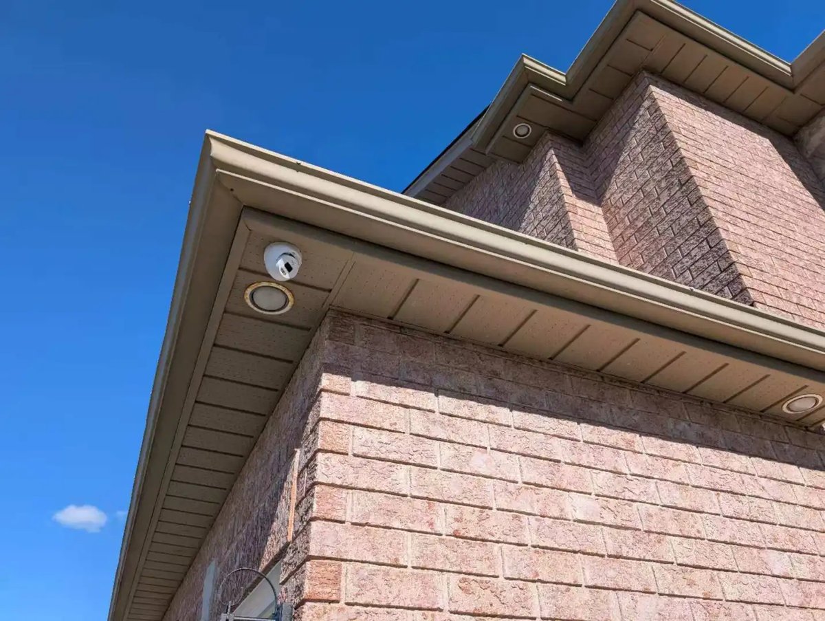 Security camera on the brick corner of a Richmond Hill house