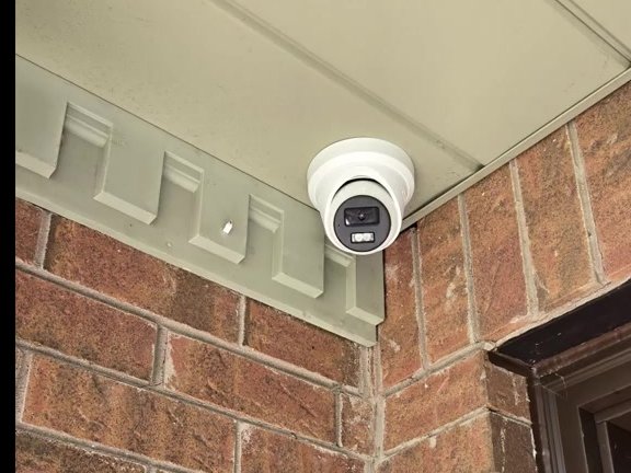 Dome security camera installed above a front porch in Richmond Hill